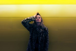woman-yellow-wall-1500x1000